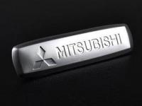 Эмблема Mitsubishi из полированного алюминия для ковриков салона - 1 шт., 18х64 мм